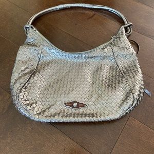 Elliott Lucca woven purse in a metallic colour.